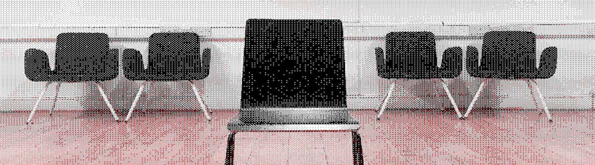 A row of chairs in a studio, similar to an audition panel